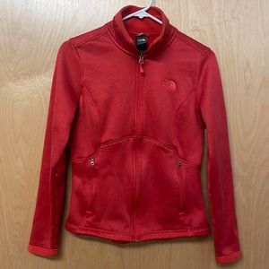 The North Face full zip, lightweight jacket. Is a dark coral color Size S/P.